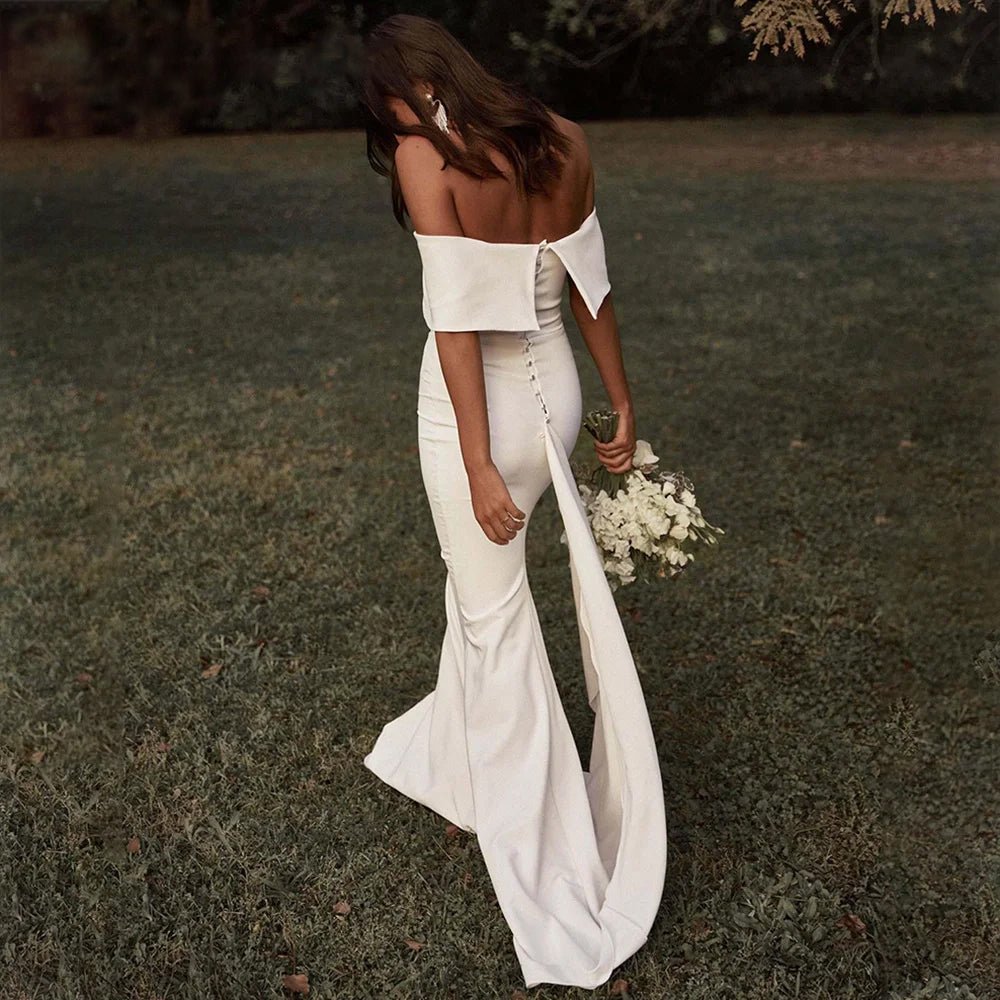 back of bride walking outside wearing Boho Off-the-Shoulder Mermaid Wedding Dress