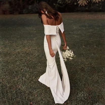 back of bride walking outside wearing Boho Off-the-Shoulder Mermaid Wedding Dress