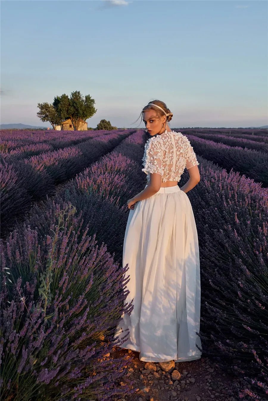 Back view of a bride in a field wearing a Boho Two Piece Short Sleeve O-neck A-Line Wedding Dress