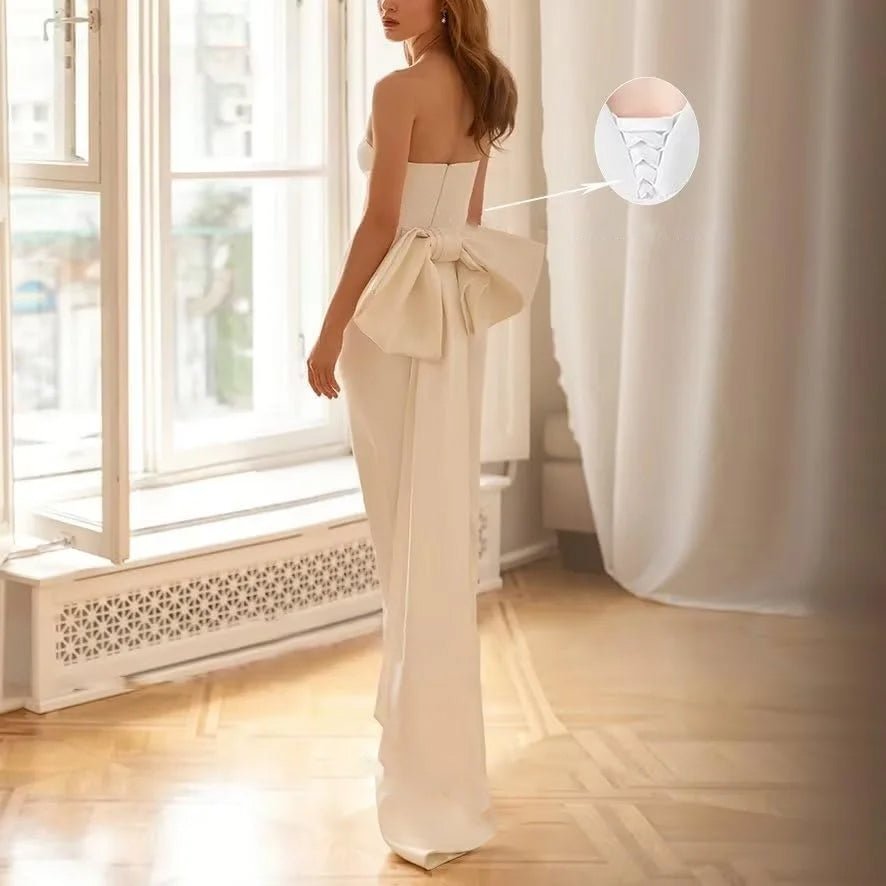 Back view of a bride wearing a Mid-Calf Strapless Satin Backless Wedding Dress With Bow