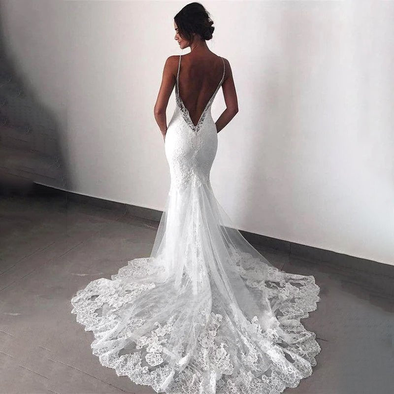 back view of a bride wearing a White Elegant Vintage Backless Lace Mermaid Wedding Dress