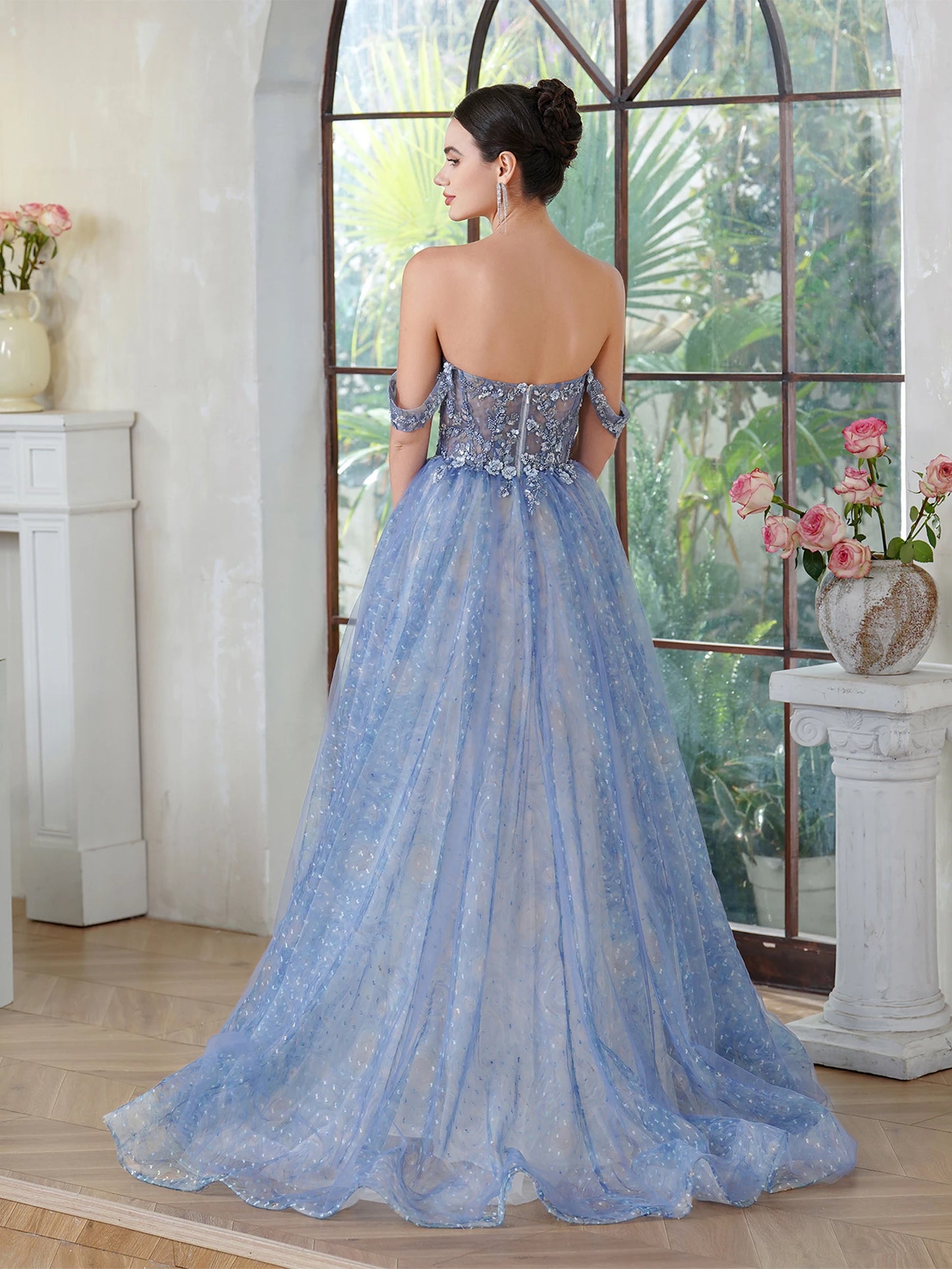 back view of prom girl wearing blue sparkling off-the-shoulder a-line dress