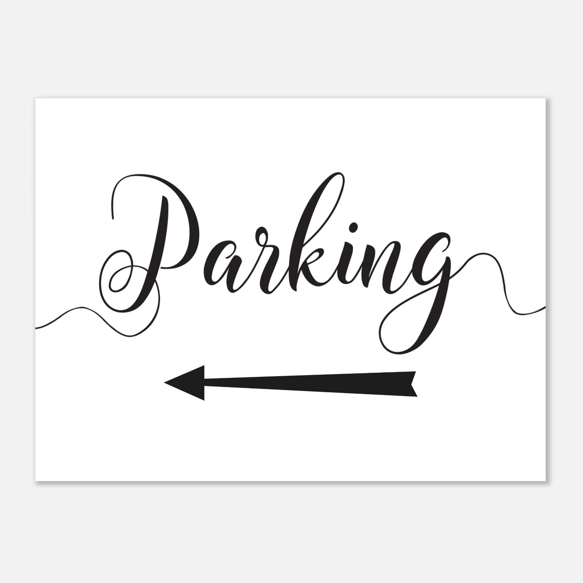 A white rectangular sign with black script reading 'Parking' and a black left-pointing arrow below, shown on a light gray background.