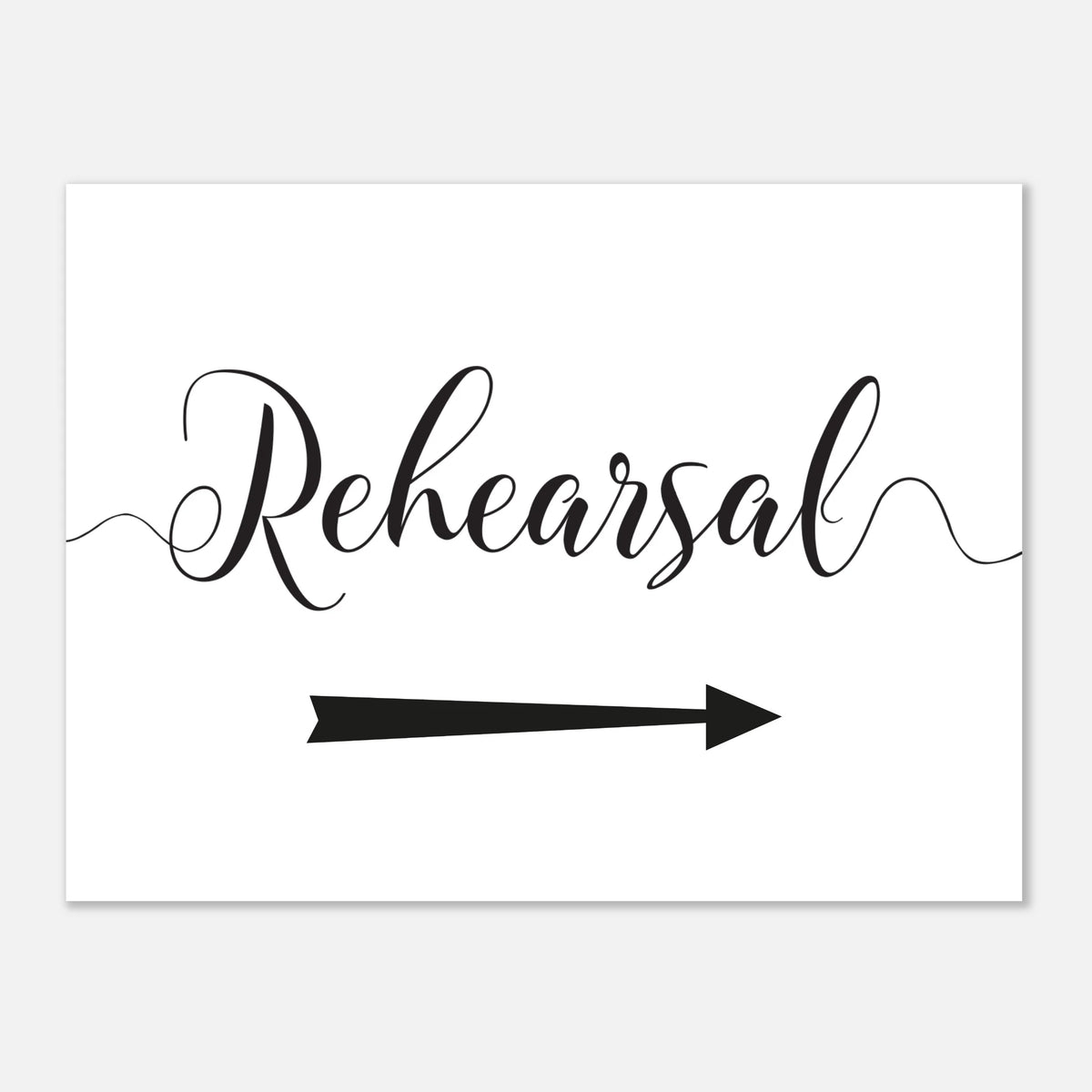 A white rectangular sign or card with the word 'Rehearsal' in black cursive script and a black arrow pointing to the right, shown on a light gray background.