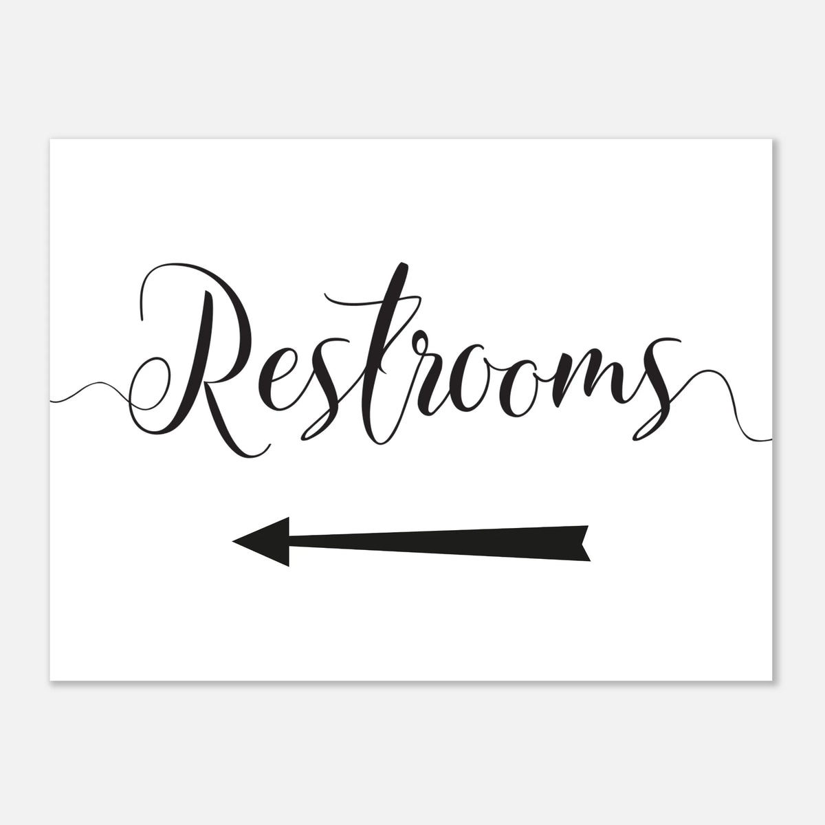 A white rectangular sign with the word 'Restrooms' in black cursive script and a black left-pointing arrow below, shown on a light gray background.