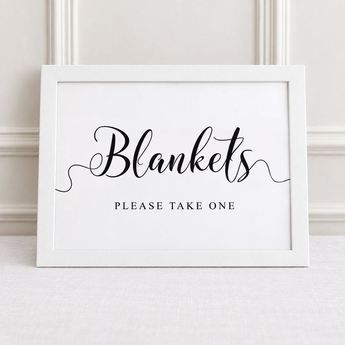 blankets please take one white framed wedding reception sign