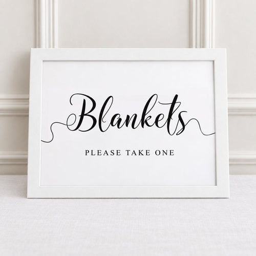 blankets please take one white framed wedding reception sign