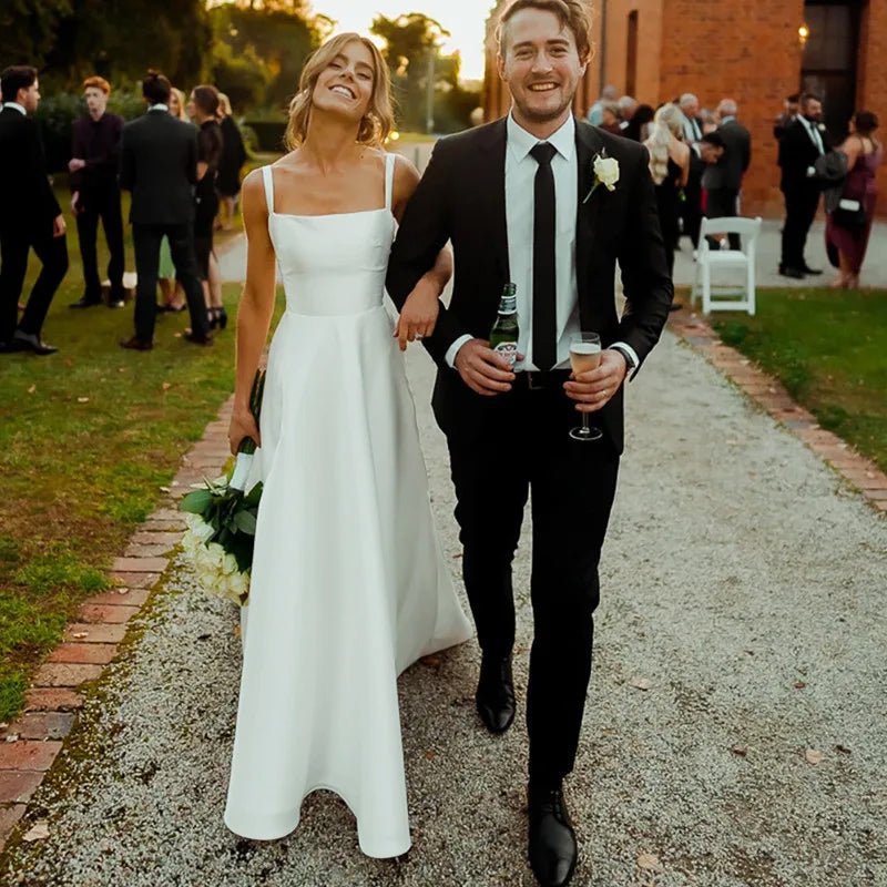 bride and groom leaving church wearing a Classic White A-Line Pleat Vintage Wedding Dress