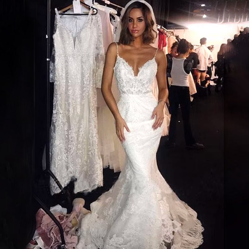 bride at fashion show wearing Elegant Vintage Backless Lace Mermaid Wedding Dress