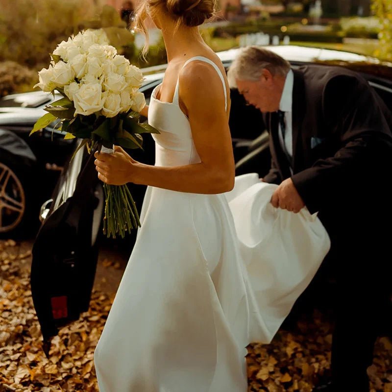 bride exiting wedding car wearing Classic A-Line Pleat Vintage Wedding Dress