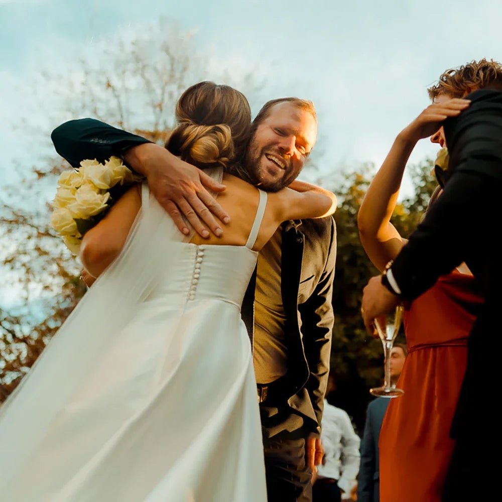 bride hugging guests wearing Classic A-Line Pleat Vintage Wedding Dress