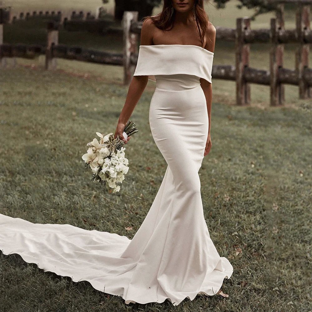 bride in a field wearing an Ivory Boho Off-the-Shoulder Mermaid Wedding Dress