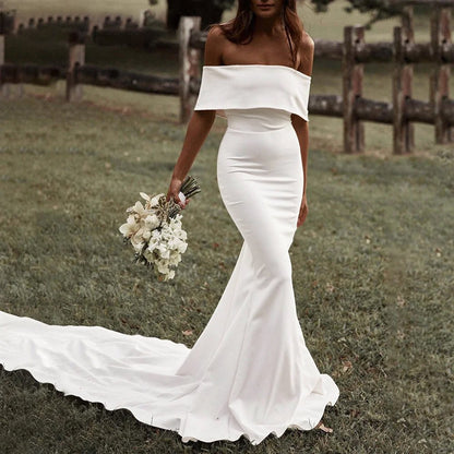 bride in a field wearing a White Boho Off-the-Shoulder Mermaid Wedding Dress