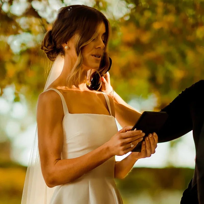 bride reading vows wearing Classic A-Line Pleat Vintage Wedding Dress