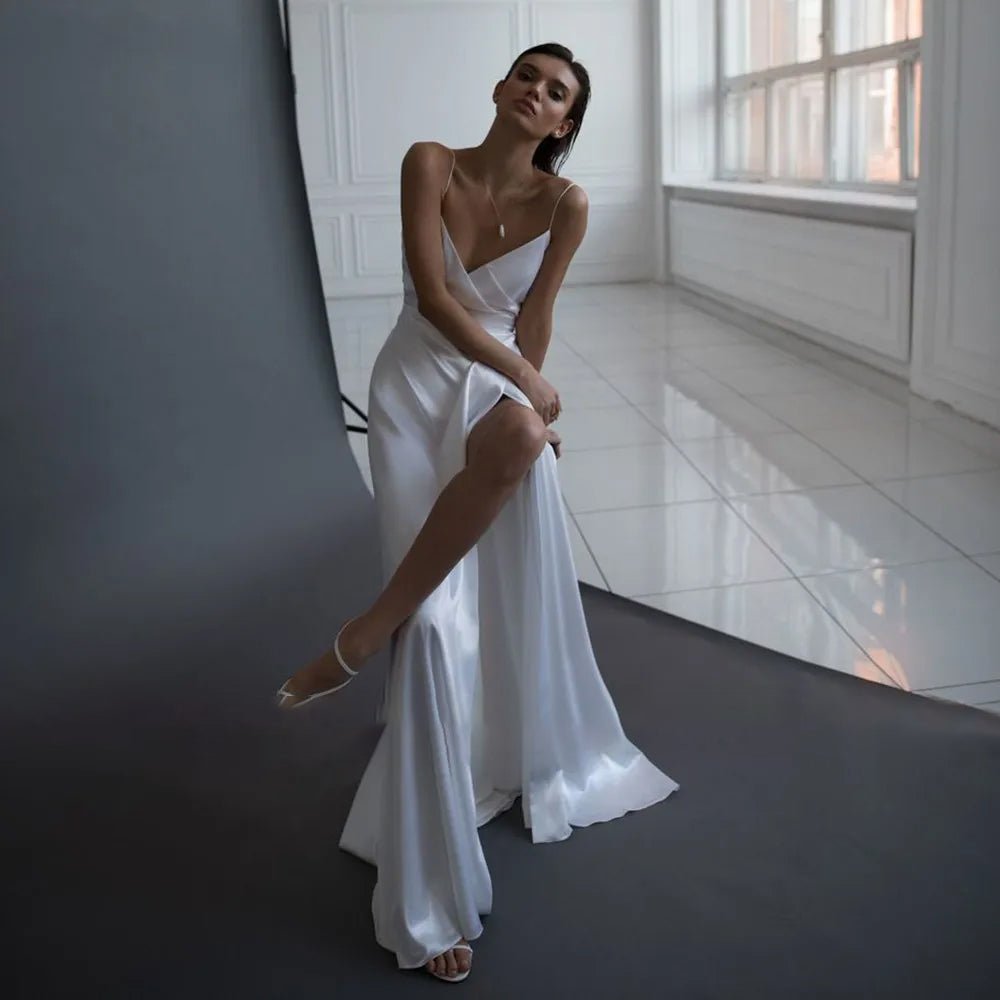 bride sitting down wearing Simple Side Thigh Slit V-Neck Satin Wedding Dress