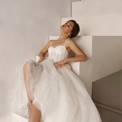 bride sitting on stairs wearing Ankle-Length Lace-Up Backless Wedding Dress