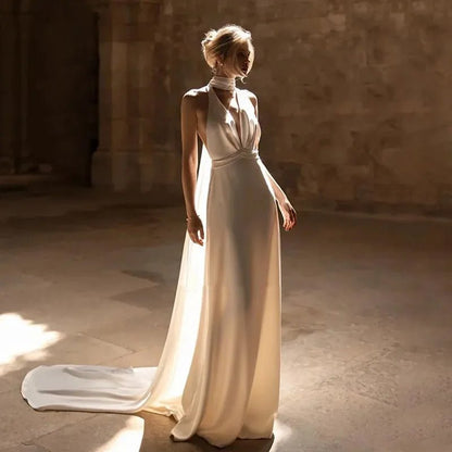 bride standing in church wearing an ivory Elegant Satin Halter Neck Wedding Dress