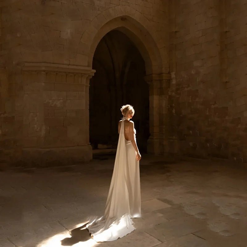 bride standing in front of church showing back of Elegant Satin Halter Neck Wedding Dress