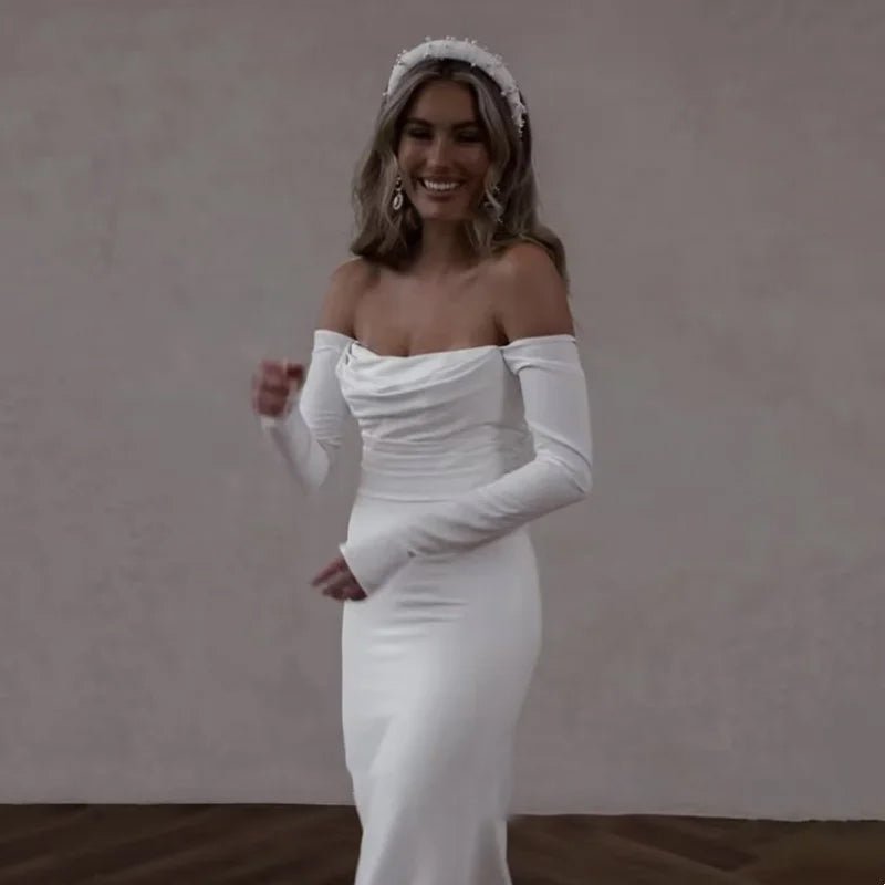 bride wearing a white Off-the-Shoulder Modern Satin Mermaid Wedding Dress with Long Sleeves