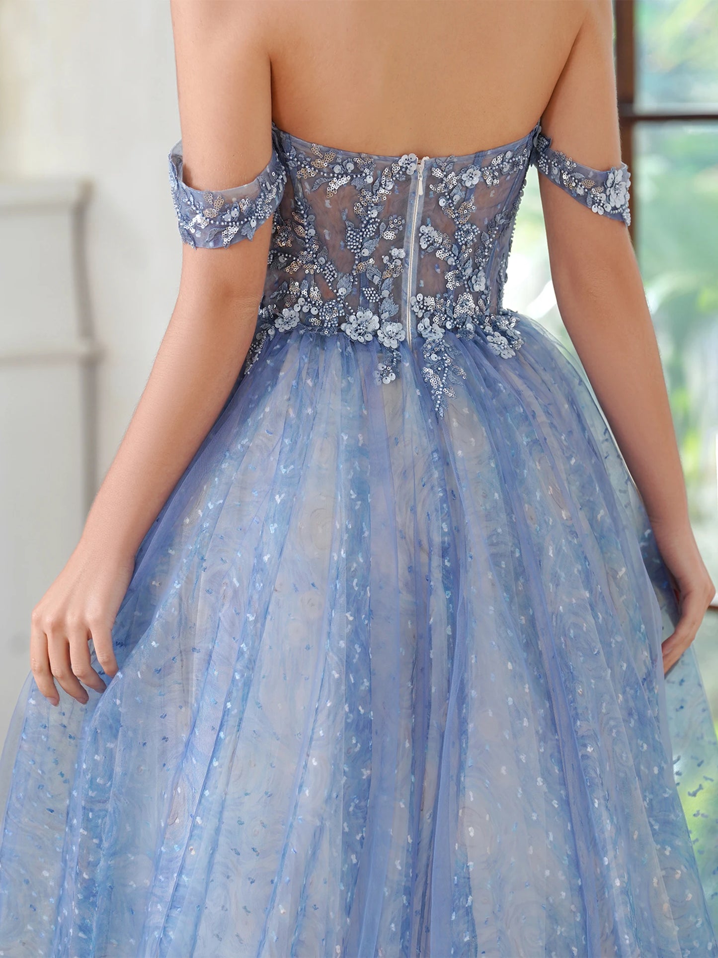 close-up back view of prom girl wearing blue sparkling off-the-shoulder a-line dress