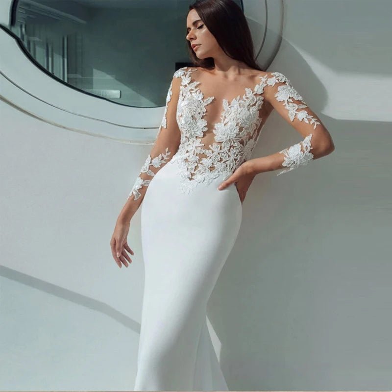 close-up view of a bride on a ship wearing a white Long Sleeve Mermaid Wedding Dress with Illusion Neckline and Lace Appliques