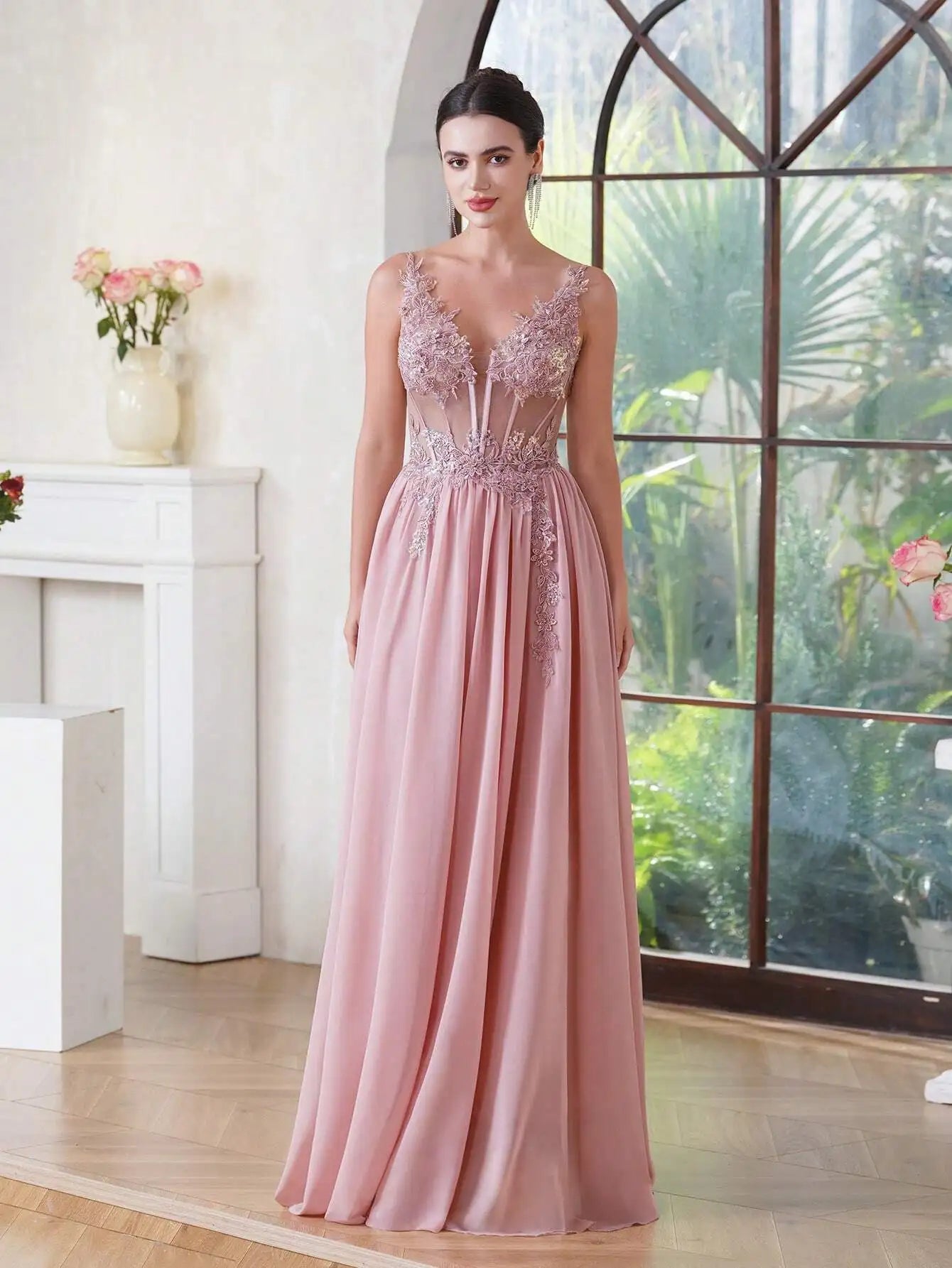 front view of a girl wearing a pink luxury backless beaded a-line prom dress