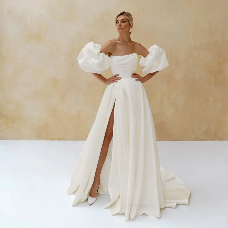 Full front view of a bride wearing an Elegant Ivory A-Line Side-Slit Satin Wedding Dress with Puff Sleeves