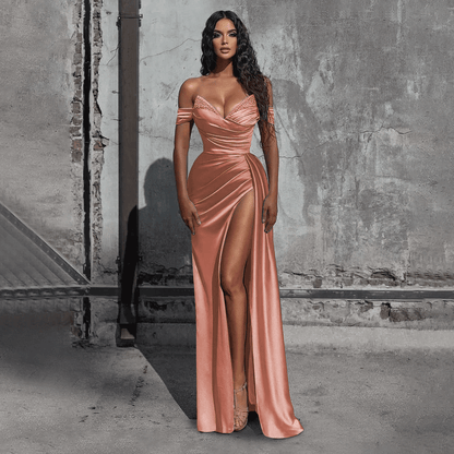 girl wearing a dusty rose off-the-shoulder beaded satin slit prom dress