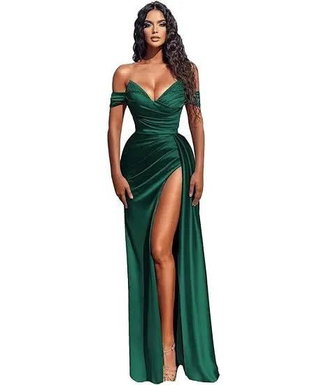 girl wearing a emerald green off the shoulder beaded satin slit prom dress