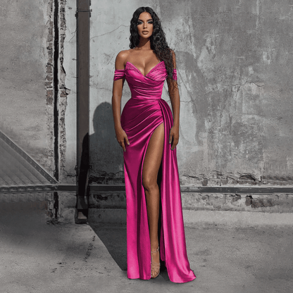 girl wearing a fuchsia off-the-shoulder beaded satin slit prom dress