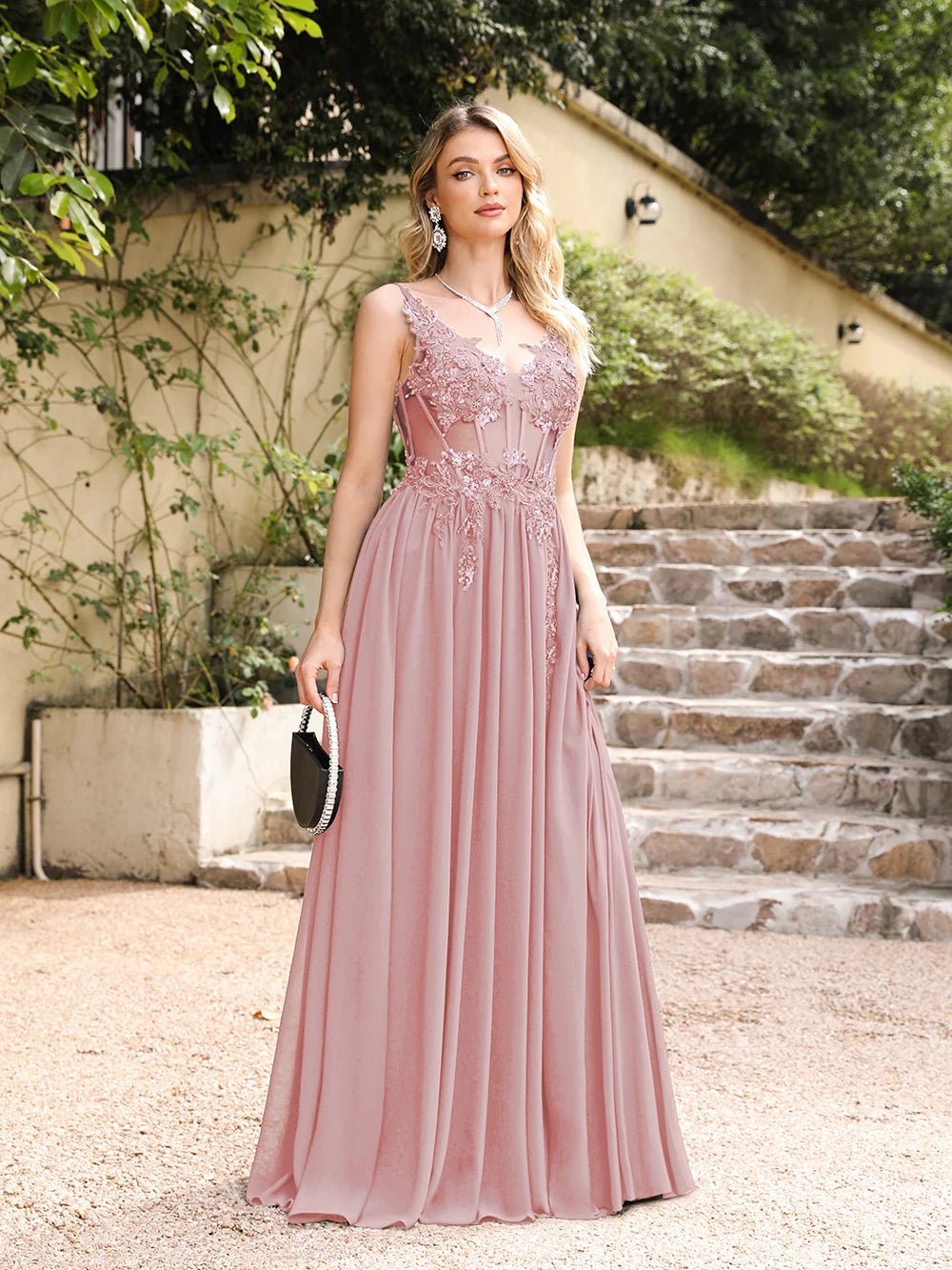 girl with head back outside wearing a pink luxury backless beaded a-line prom dress