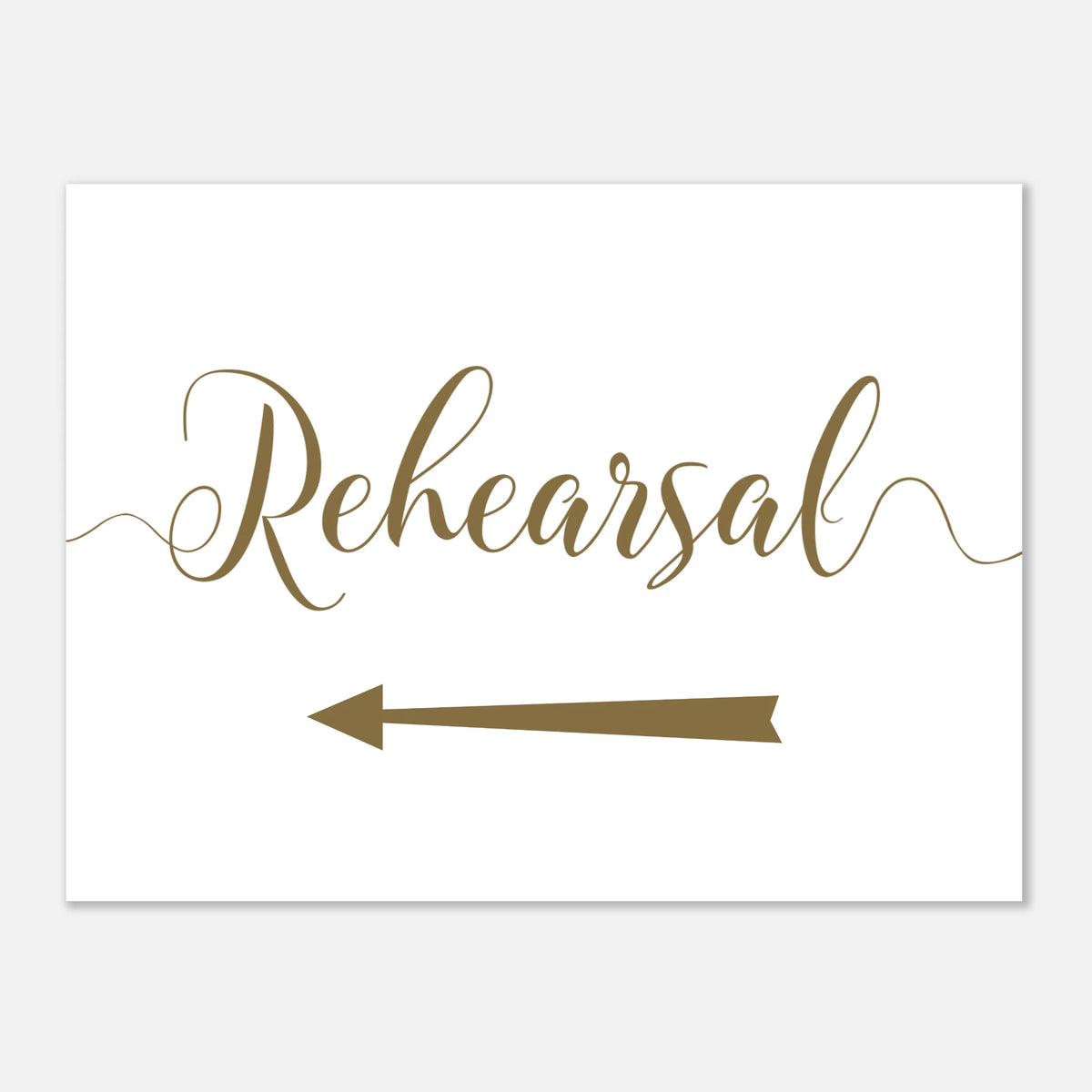 A white rectangular sign or card with the word 'Rehearsal' in elegant brown script and a matching brown arrow pointing left, shown on a light gray background.