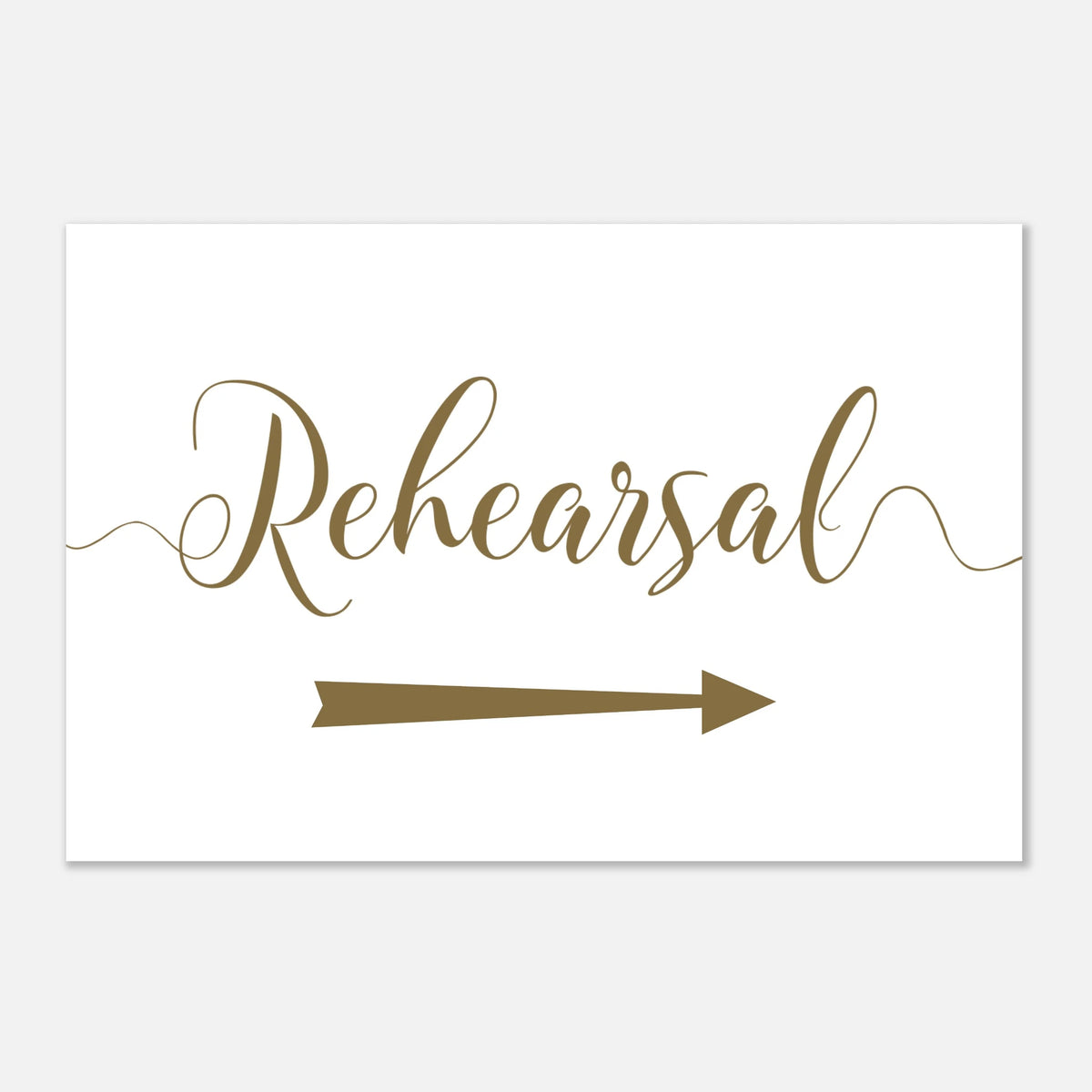 A white rectangular sign with the word 'Rehearsal' in elegant brown script and a matching brown arrow pointing right, shown on a light gray background.