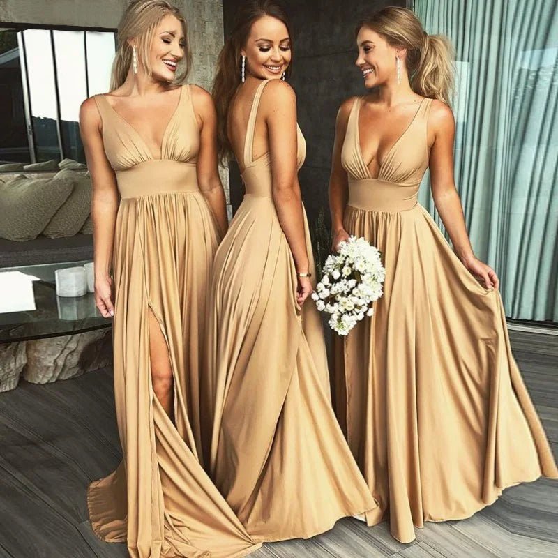 group of bridemaids wearing gold split leg v-neck backless maxi bridesmaid dress