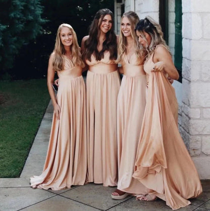 group of bridesmaids wearing champagne colored split-leg v-neck backless maxi bridesmaid dress