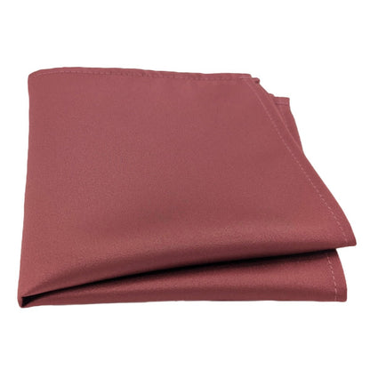 A single pocket square in a deep mauve colour, folded neatly.