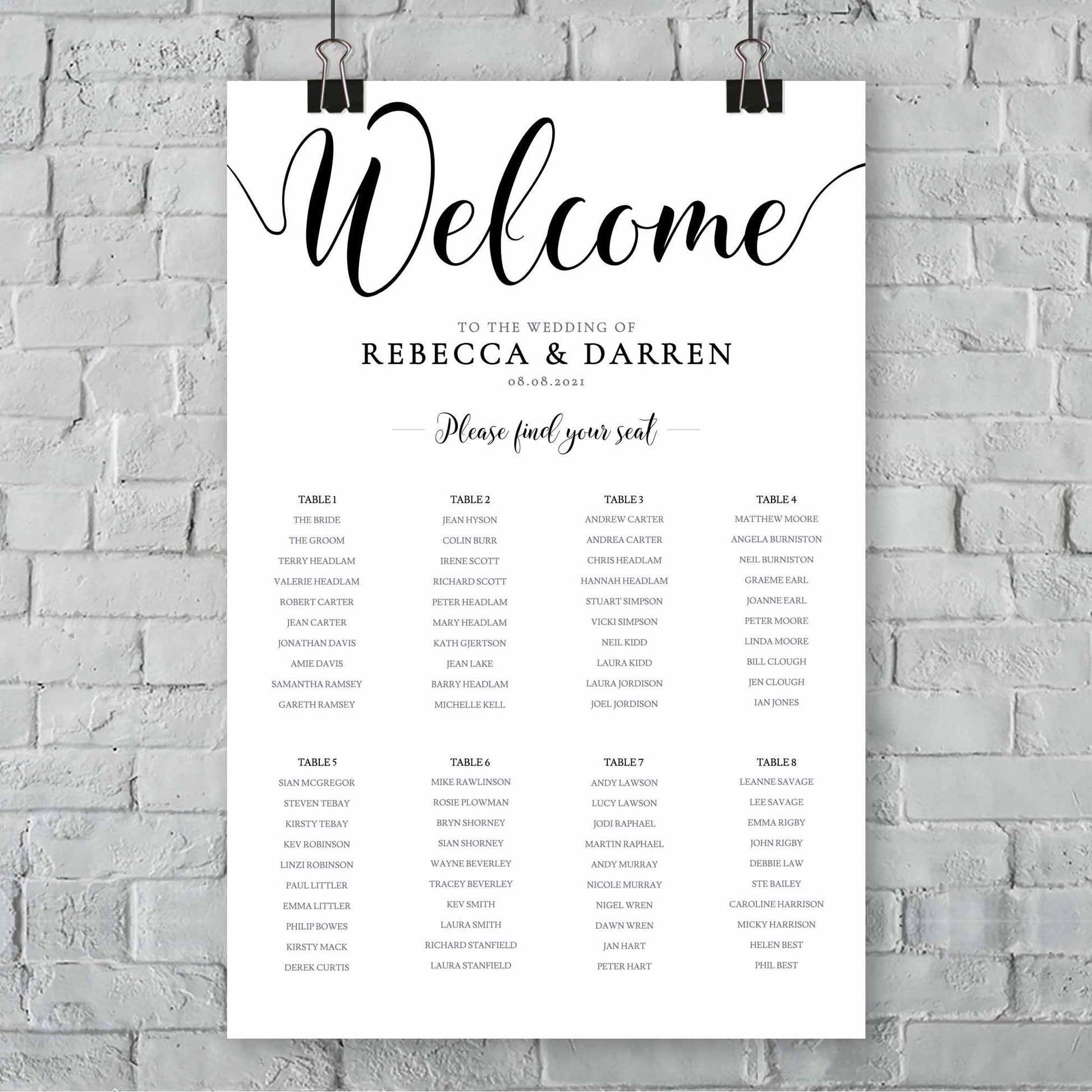 outdoor wedding seating chart with 8 tables hanging from a wall