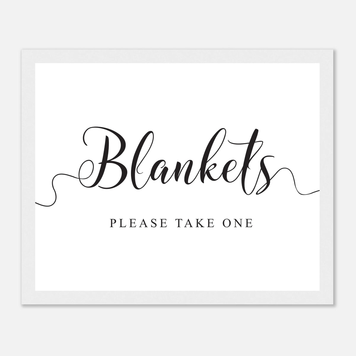 A square white sign or print with black text reading 'Blankets' in large script and 'PLEASE TAKE ONE' below, shown against a light gray background.
