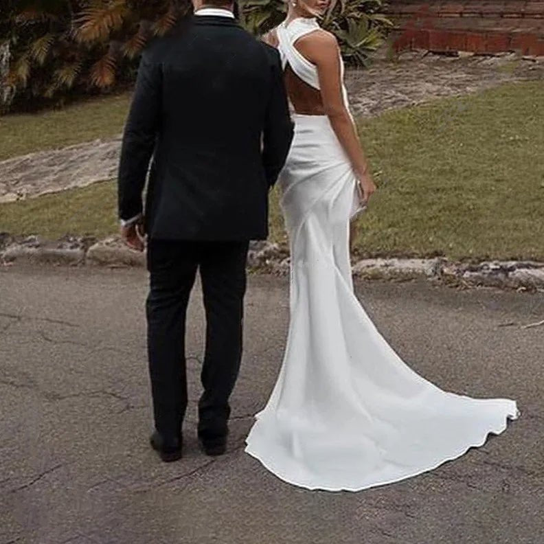 rear-view of bride and groom wearing High Side-Slit Satin Mermaid Wedding Dress