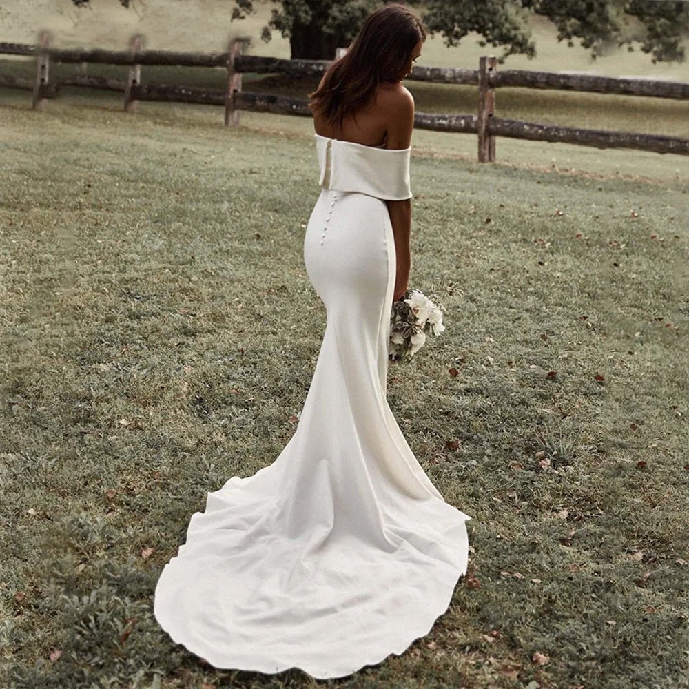 rear view of bride in field in Boho Off-the-Shoulder Mermaid Wedding Dress