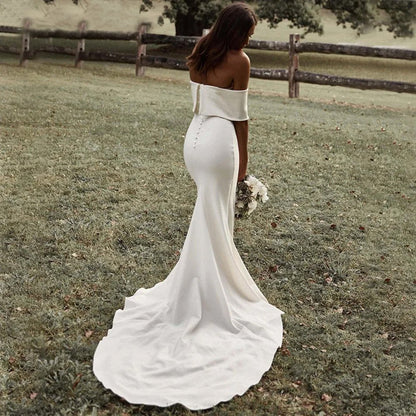 rear view of bride in field in Boho Off-the-Shoulder Mermaid Wedding Dress