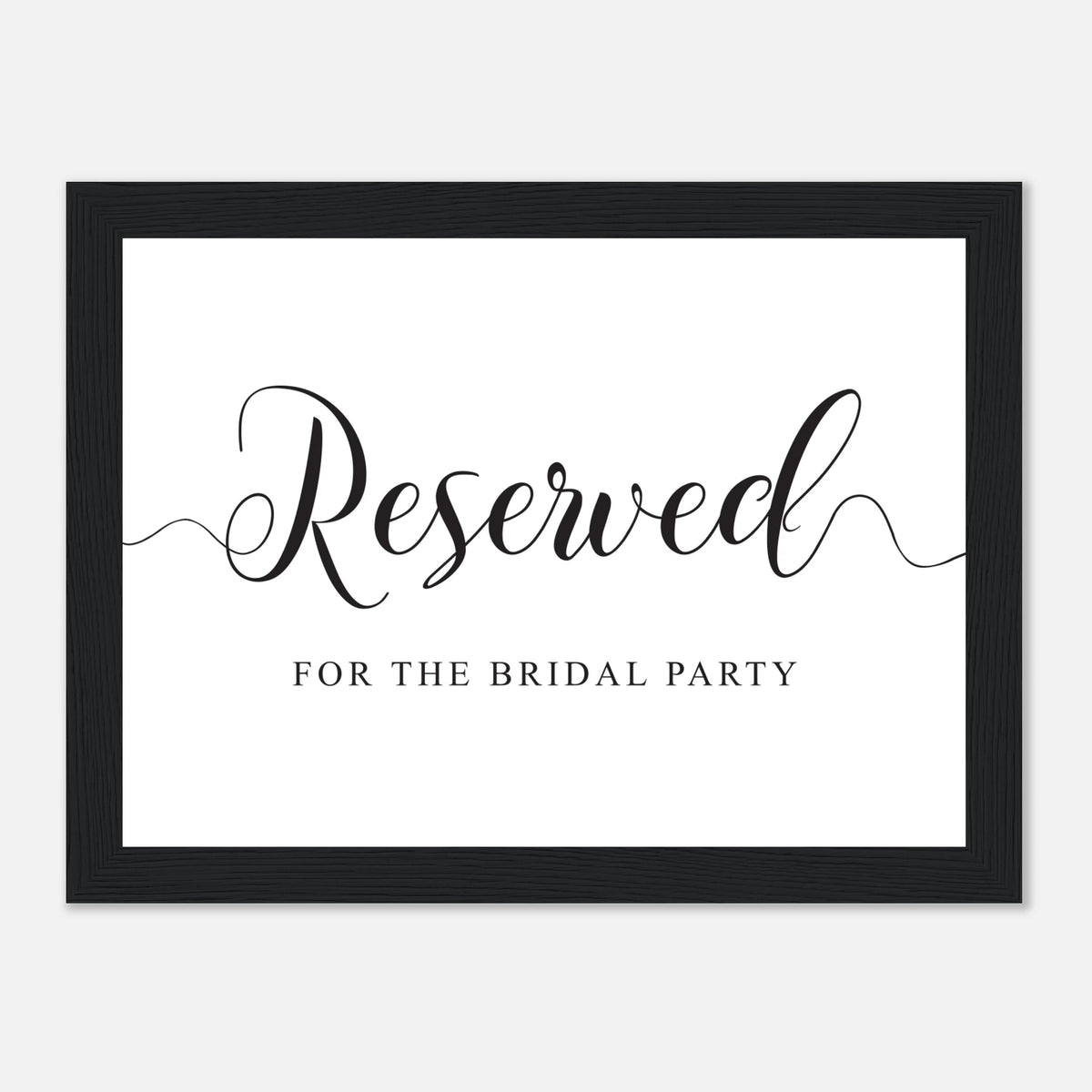 A framed bridal party reserved sign with elegant black script reading 'Reserved' and smaller text 'FOR THE BRIDAL PARTY' on a white background, enclosed in a black frame.