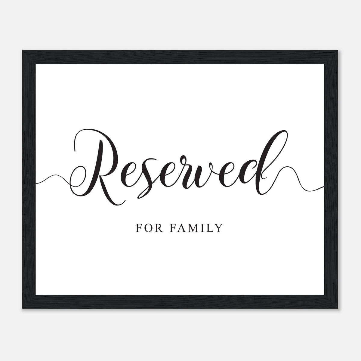 A framed typographic wall sign with the word 'Reserved' in large black script and 'FOR FAMILY' below it on a white background, enclosed in a black frame.
