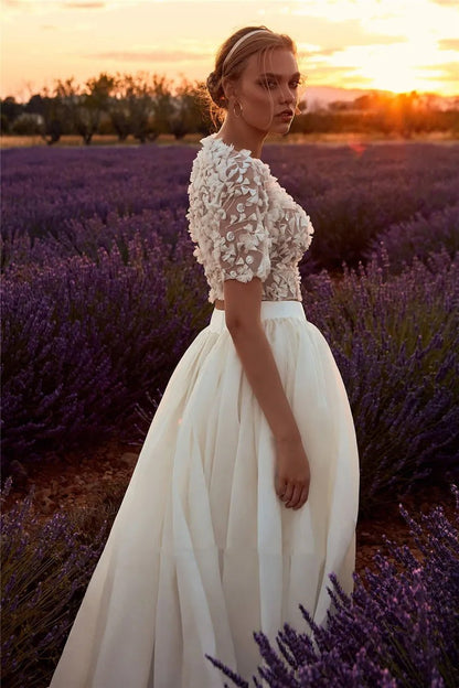 Side view of a bride in a field wearing a Boho Two Piece Short Sleeve O-neck A-Line Wedding Dress