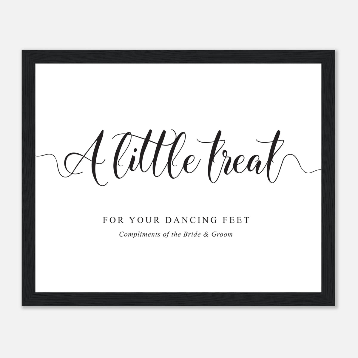 A framed typographic wall print with the phrase “A little treat” in large black script, plus smaller text reading “FOR YOUR DANCING FEET” and “Compliments of the Bride & Groom,” shown on a light gray background.