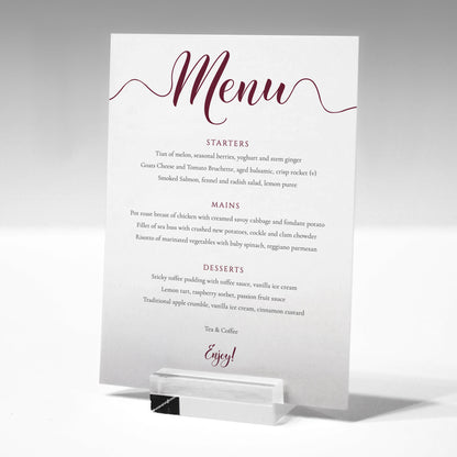 3 course burgundy wedding menu printed on card in a glass stand