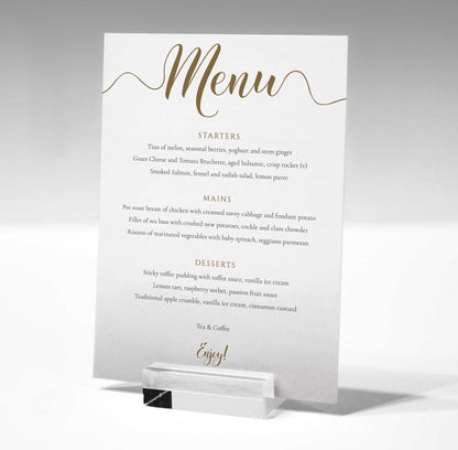 5"x7" gold wedding menu printed on white card in a glass stand