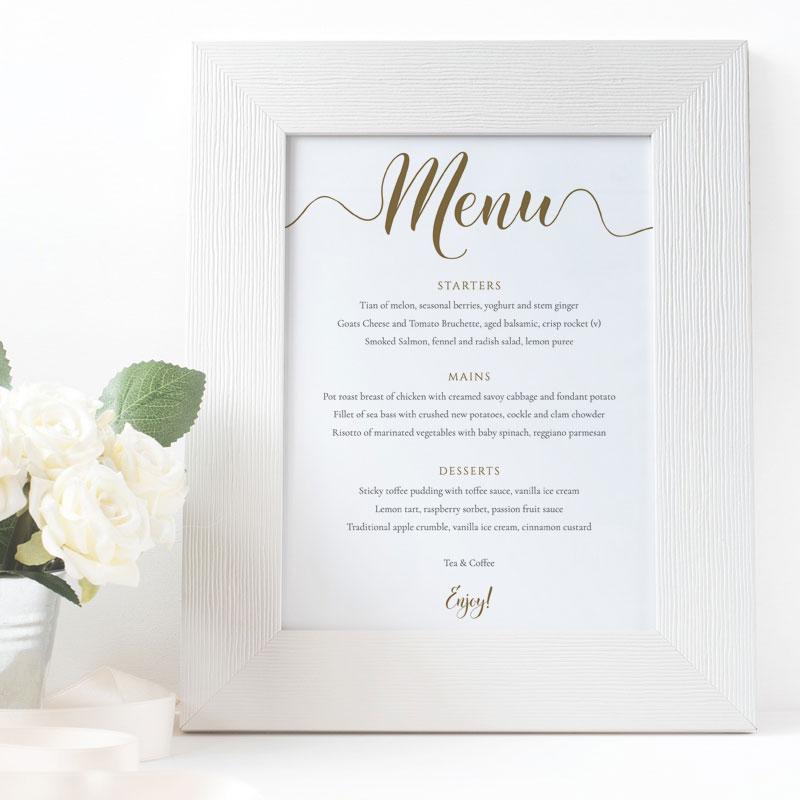 Elegant gold wedding menu in a white picture frame