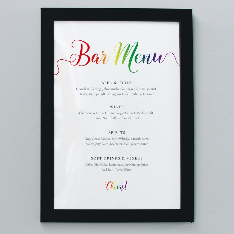 framed pride rainbow drinks menu at a lesbian wedding