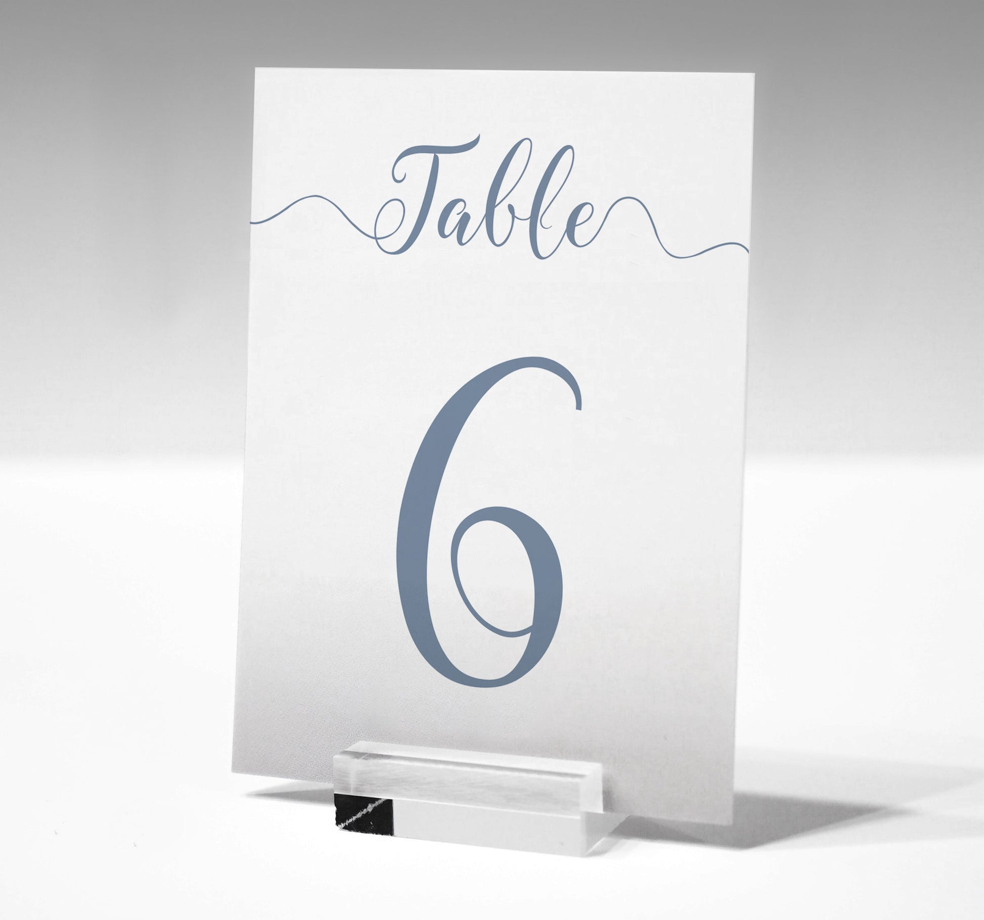 7x5 dusty blue table number printed on card in a glass stand